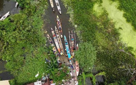 Boats bring Philippine flood victims to safety as death toll rises