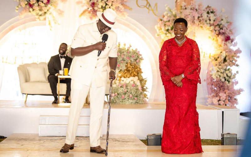 Ruto dazzles in all white Kaunda suit, matching fedora hat at Mudavadi’s son’s wedding Ruto dazzles in all white Kaunda suit, matching fedora hat at Mudavadi's son's wedding