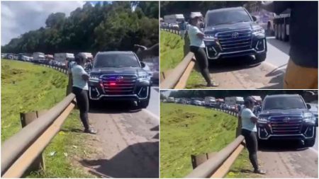 Woman defiantly blocks overlapping VIP car armed with siren, strobe lights bullying way through traffic